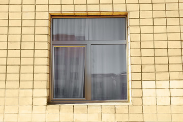 Fototapeta premium Modern plastic window on brick wall background
