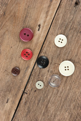 buttons on a wooden board