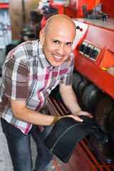 Professional efficient craftsman polishing footwear