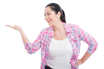 Pretty young female holding something in her hand