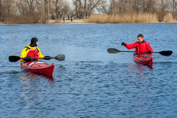 two man kayaking on the red kayak on the river 01