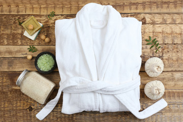 Beautiful spa composition with bathrobe and accessories - obrazy, fototapety, plakaty