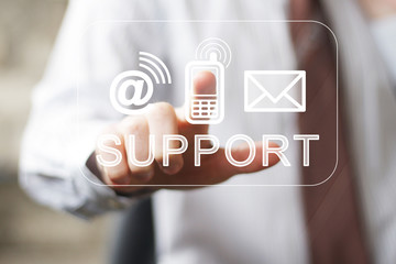 Businessman presses button support kontakt in network contakt.