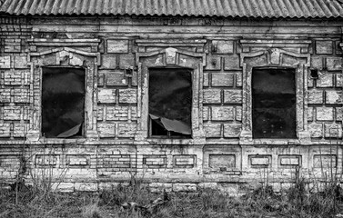 ruined house in a poor residential quarter in a slum. Noise and grain are added deliberately by a...