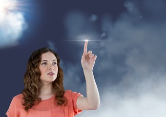 Woman touching a flare against sky in background