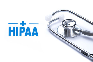 Page with HIPAA (The Health Insurance Portability and Accountability Act of 1996) on the table with stethoscope, medical concept