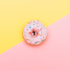 pastel pink donut in minimal. fashion trend of fast food.