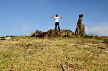 Boy on top of mountain, freedom