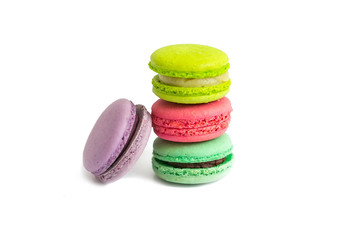 Multicolored macaroon cookies on a white background.