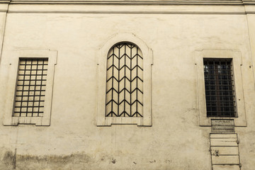 Lattice windows of an old classic building in Rome, Italy