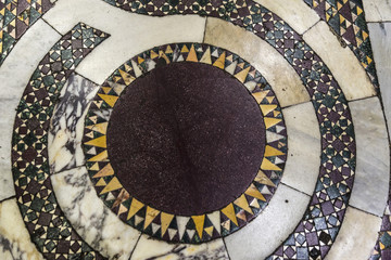Marble floor decorated with mosaics in a church in Rome, Italy