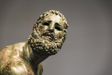 Roman bust or statue made with bronze of a human face