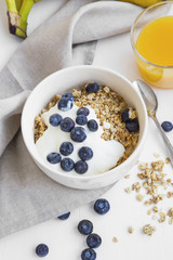 Muesli granola bowl with yogurt and blueberries