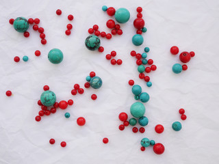 Abstract background with beads of natural stone. Beads of turquoise and coral. Materials for handmade jewelry.