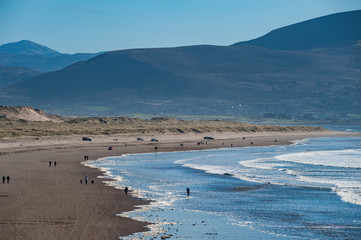 People walking Inch Beach on the wild atlantic way in Co.Kerry, Ireland.