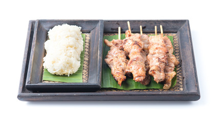Thai styled grilled pork and sticky rice isolated on white