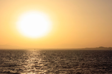 beautiful sunset over sea and mountains