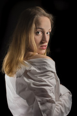 Young girl with white shirt on black background