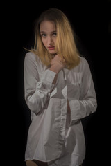 Young girl with white shirt on black background