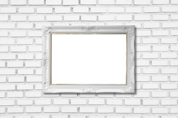 white frame on white brick wall