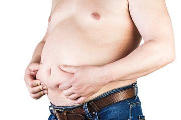 Naklejka premium Excess body weight of a man with his hands touching fat on his stomach is the concept of obesity. Not the right food.