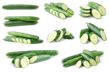 Cucumber and slices isolated over white background.