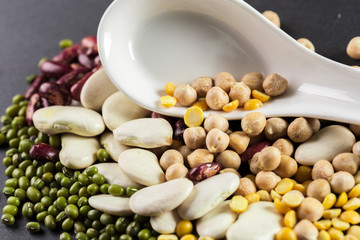 mix of beans on wooden table
