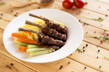 Roasted carrots, potato and cut meat, plain rustic dish