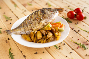 Roasted dorado fish with vegetables