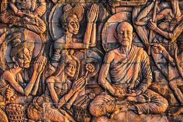 Art on the stone about buddha story on temple wall Thailand