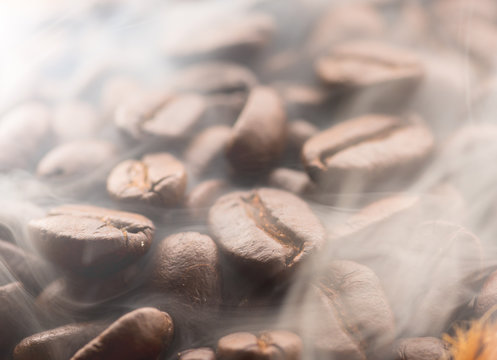 Coffee beans roasting with smoke,Selective focus