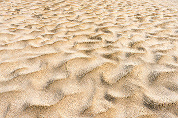 Wavy sand on the beach. Abstract.
