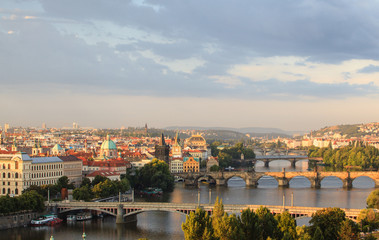 Fototapeta na wymiar Attractive morning view of Prague bridges and old town, Czech Republic