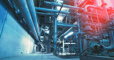 Equipment, cables and piping as found inside of a modern industrial power plant
