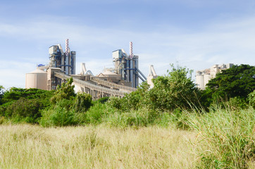 Fototapeta na wymiar Cement Factory with cloudy sky