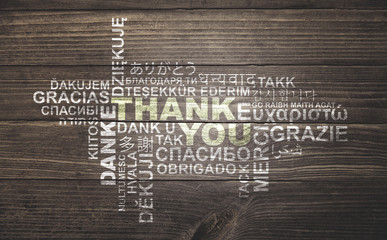 thank you, thanks in different languages, word cloud on vintage rustic wood planks floor