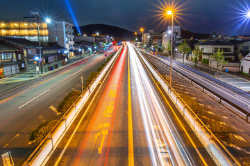 Fototapeta na wymiar Traffic lights on the street of Kyoto city at night, Japan