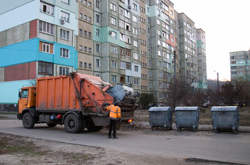 The garbage truck cleans up garbage