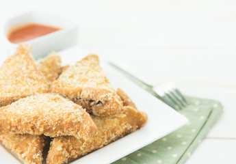Fried bread slices with tasty sauce
