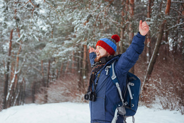 Man Traveler with backpack hiking Travel Lifestyle adventure concept active vacations outdoor. Beautiful landscape  forest