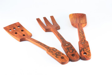 Old wooden spoons and stirrers. Isolated