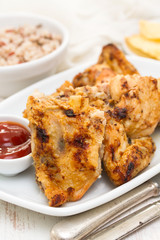 grilled chicken with sauce on dish
