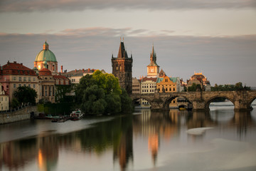 Fototapeta na wymiar The Charles Bridge in Prague at sunrise and the surrounding houses