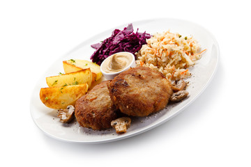 Fried steaks and potatoes with vegetalbes