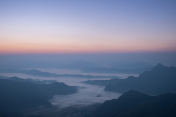 Fototapeta na wymiar beautiful mist on the hill during sunrise