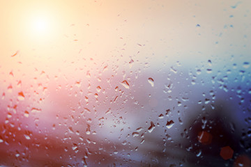 Glass in drops of rain. Sunlight