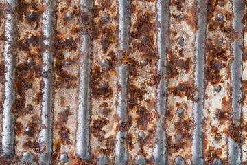 Texture of old rusty metal with stripes and patterns closeup