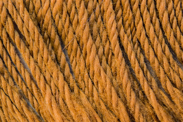 Background the surface of wool yarn with a pile of brown closeup
