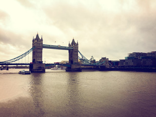 Fototapeta na wymiar darken colored tower bridge at London, england
