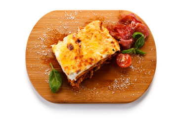 Lasagna on cutting board